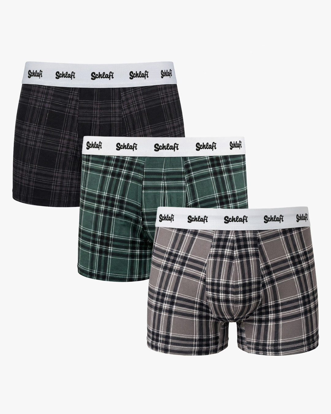 Dreierpack Herren-Boxershorts mit Karomuster in Schwarz, Grün und Grau, jeweils mit weißem „Schlafi“-Elastikbund. Freigestellte Produktdarstellung vor neutralem Hintergrund.