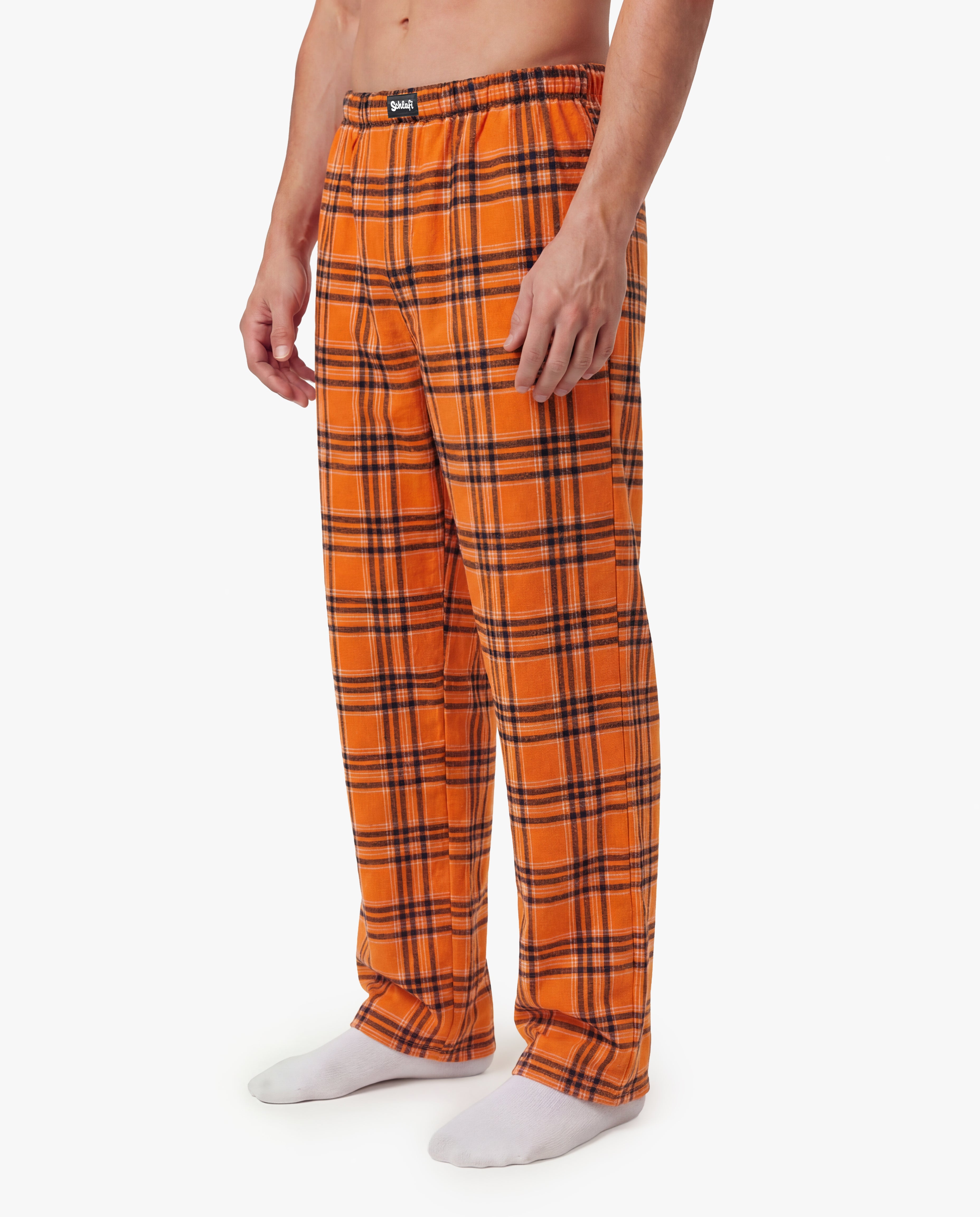 Schlafi Orange –orange karierte Freizeithose für Herren mit lockerem Schnitt“.