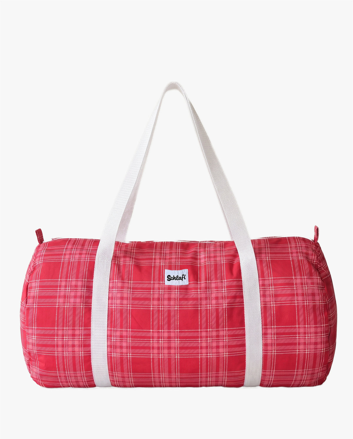Zylinderförmige Schlafi Reisetasche in Rot mit feinem Karomuster, weißen Henkeln und kleinem Logo auf der Vorderseite.